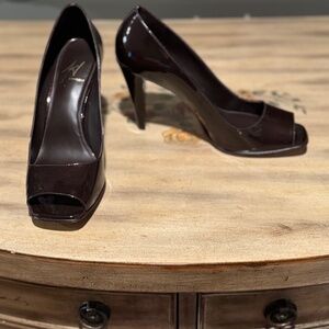 Brown patent leather heels peep toe.